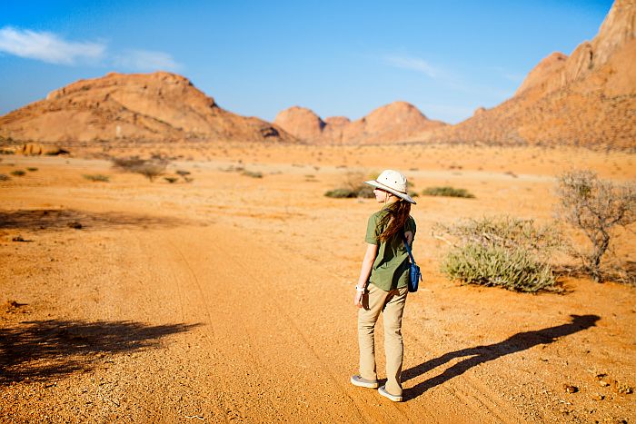 Girl walking in the Damaraland area - Family Lodges in Namibia
